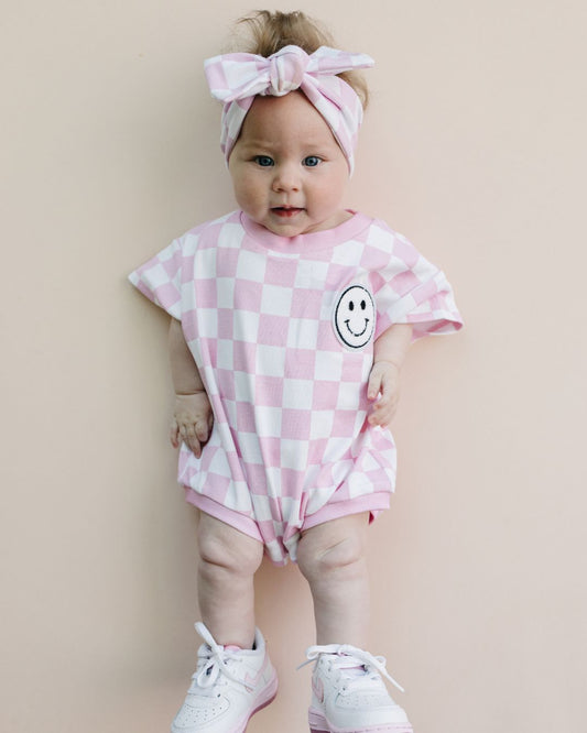short sleeve bubble romper // checkered smiley pink