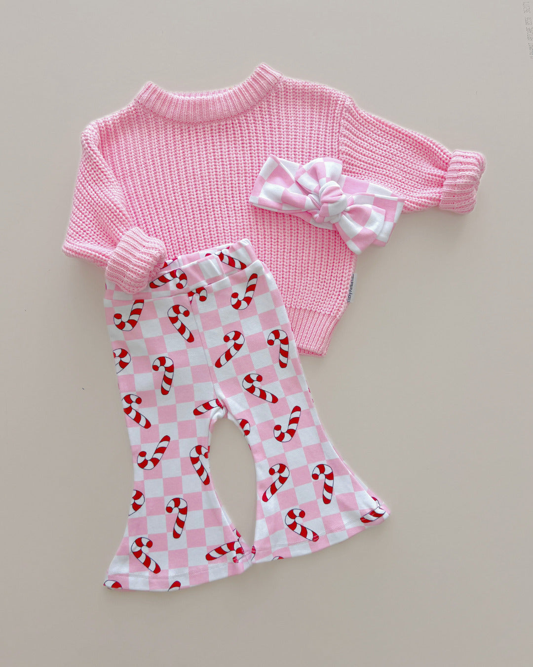 checkered candy cane flare pants // pink (available in extended sizing up to 8/9)