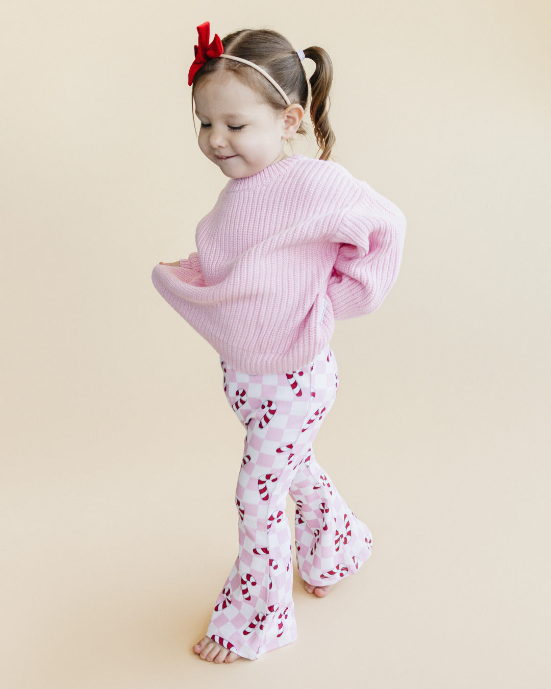 checkered candy cane flare pants // pink (available in extended sizing up to 8/9)