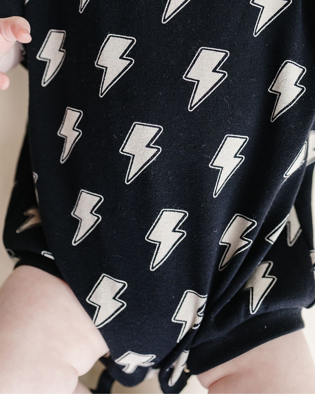 short sleeve bubble romper // black lightning bolts