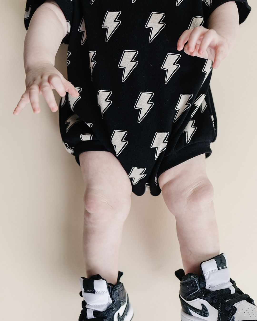 short sleeve bubble romper // black lightning bolts