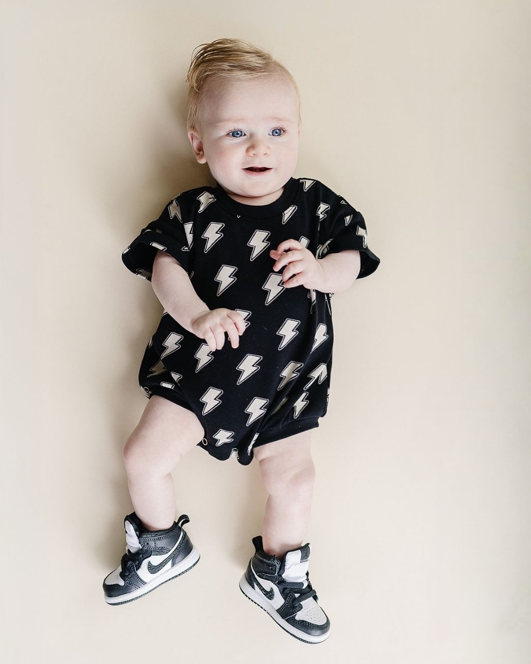 short sleeve bubble romper // black lightning bolts