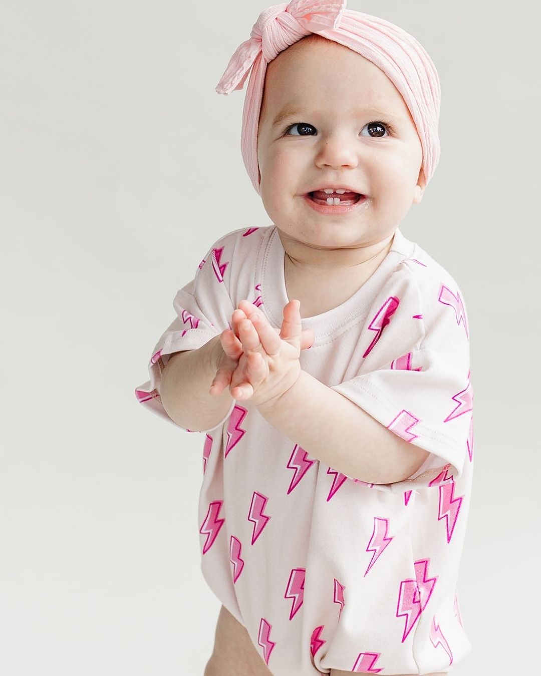 short sleeve bubble romper // pink lightning bolts