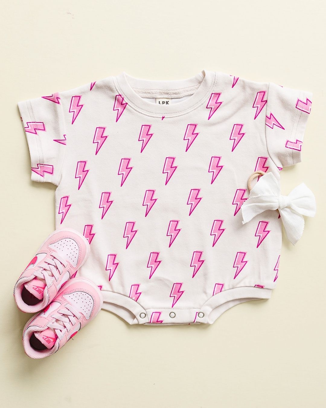 short sleeve bubble romper // pink lightning bolts