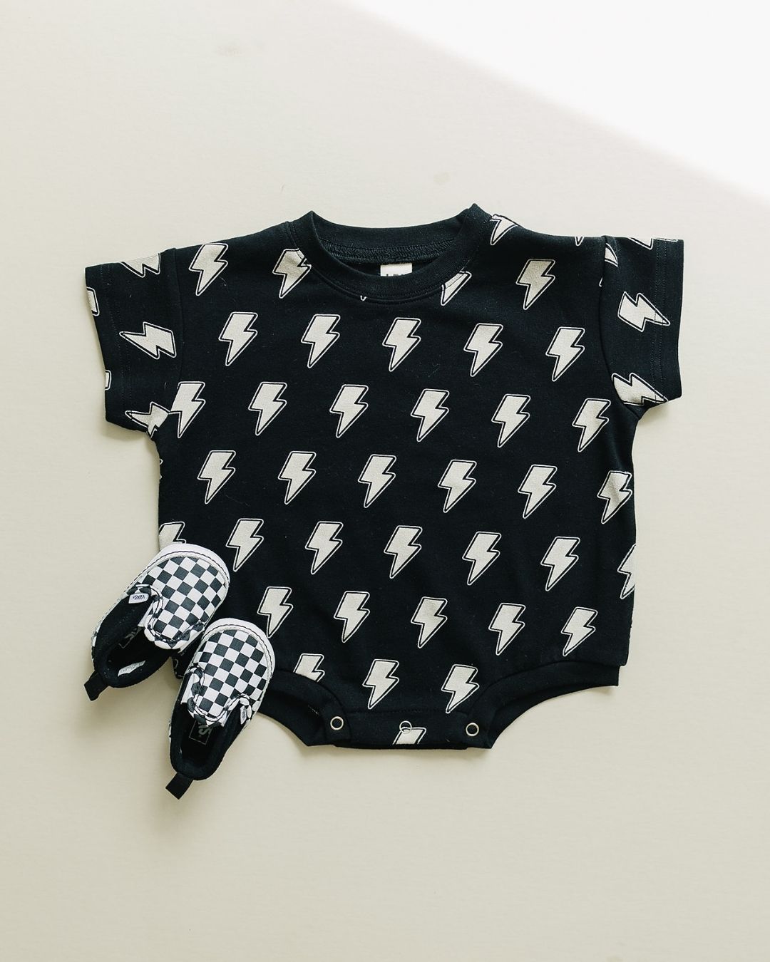 short sleeve bubble romper // black lightning bolts