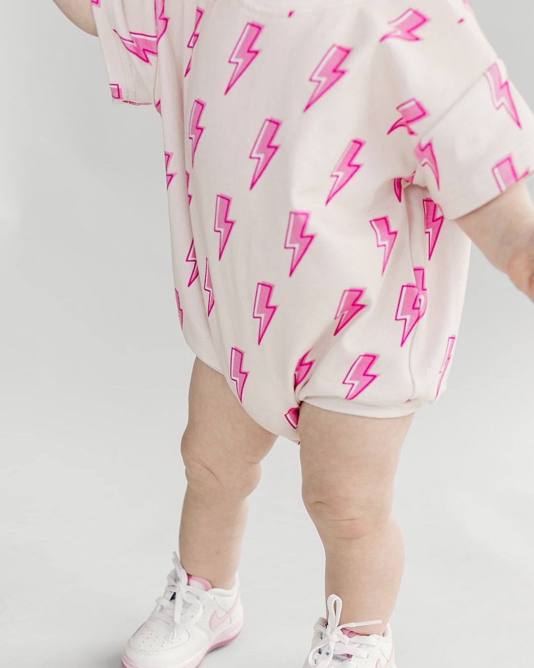 short sleeve bubble romper // pink lightning bolts