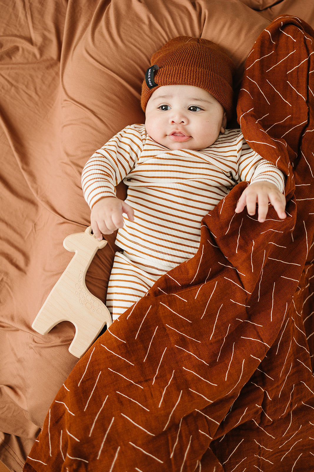 muslin swaddle blanket // rust mudcloth
