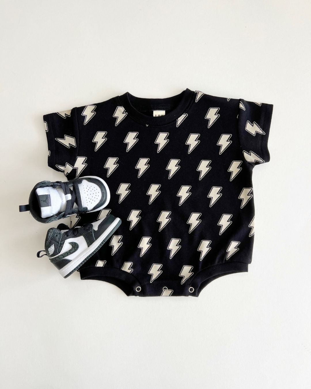 short sleeve bubble romper // black lightning bolts