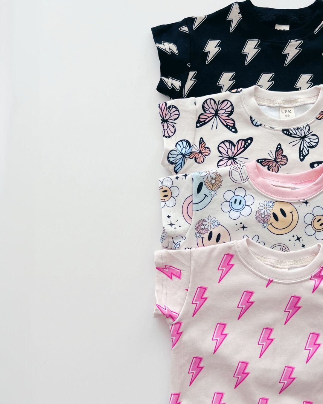 short sleeve bubble romper // black lightning bolts