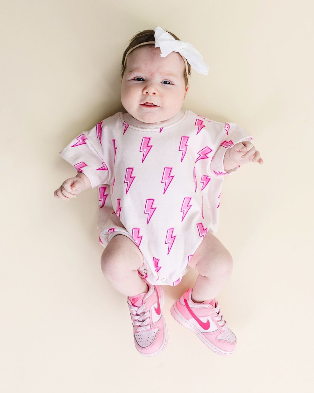 short sleeve bubble romper // pink lightning bolts