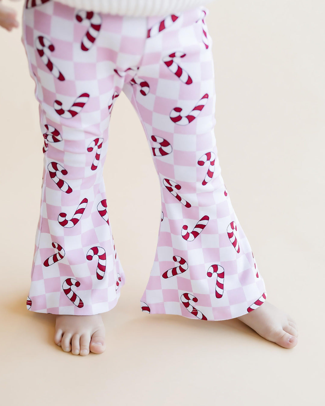 checkered candy cane flare pants // pink (available in extended sizing up to 8/9)