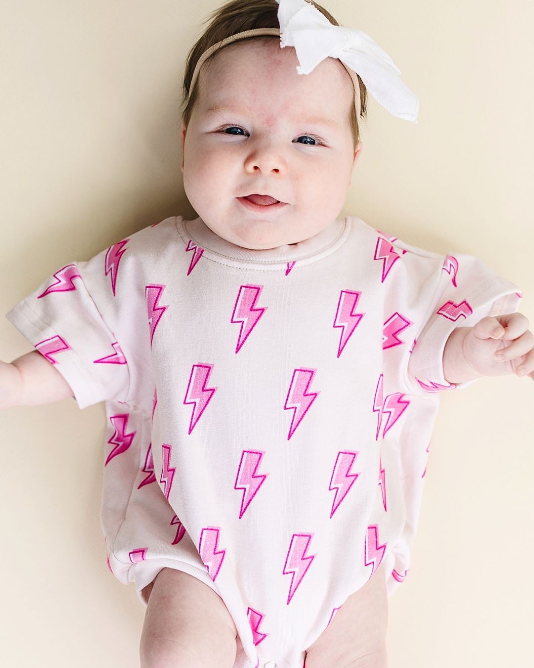 short sleeve bubble romper // pink lightning bolts