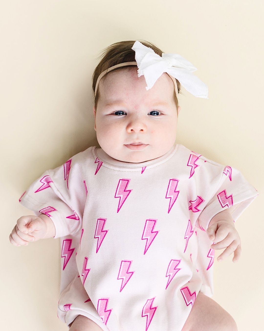 short sleeve bubble romper // pink lightning bolts