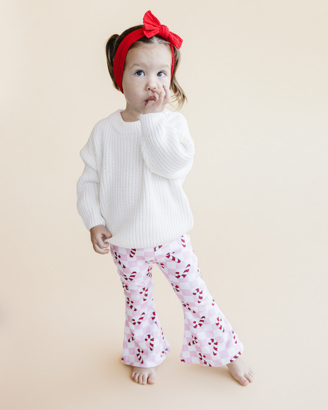 checkered candy cane flare pants // pink (available in extended sizing up to 8/9)