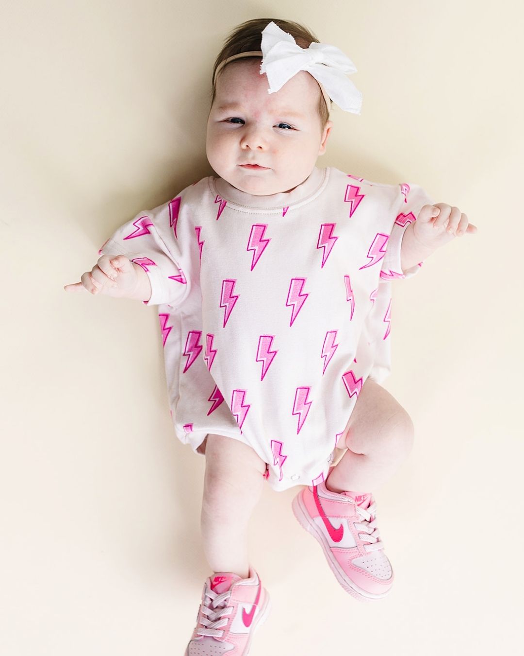 short sleeve bubble romper // pink lightning bolts