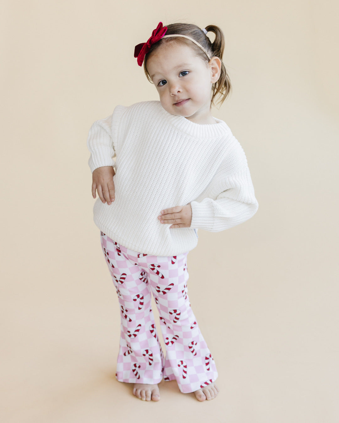 checkered candy cane flare pants // pink (available in extended sizing up to 8/9)