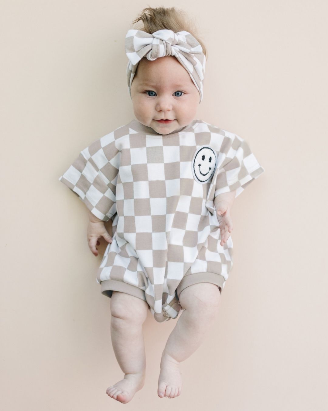 short sleeve bubble romper // checkered smiley latte