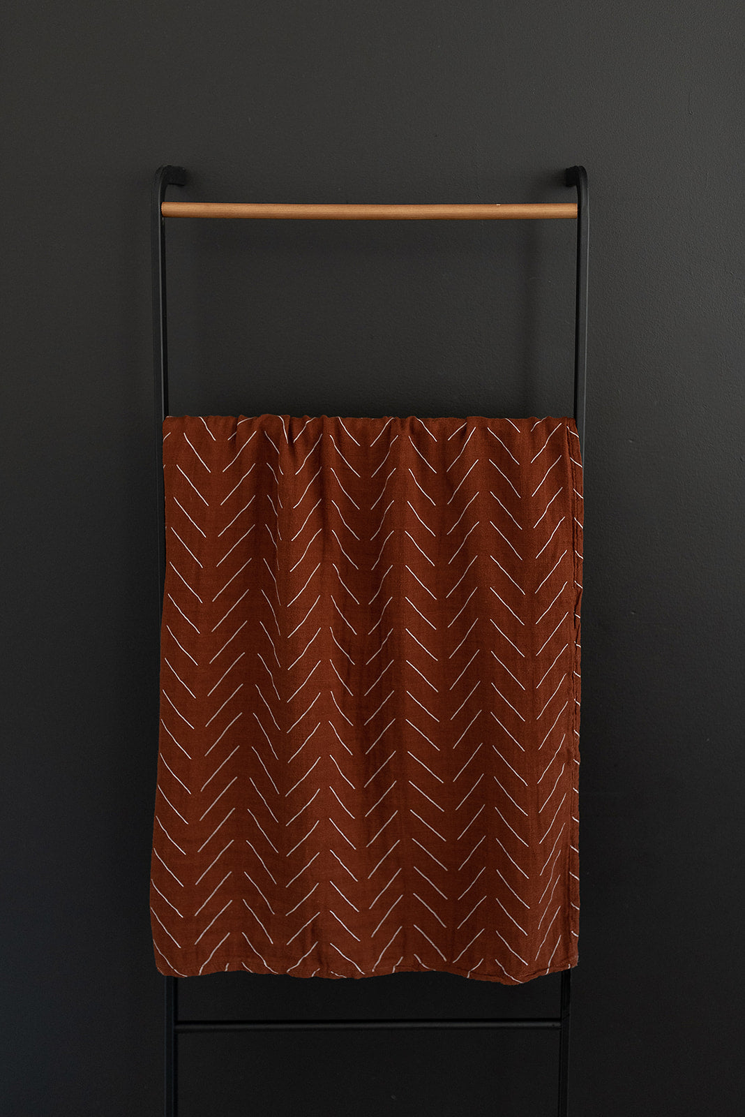 muslin swaddle blanket // rust mudcloth