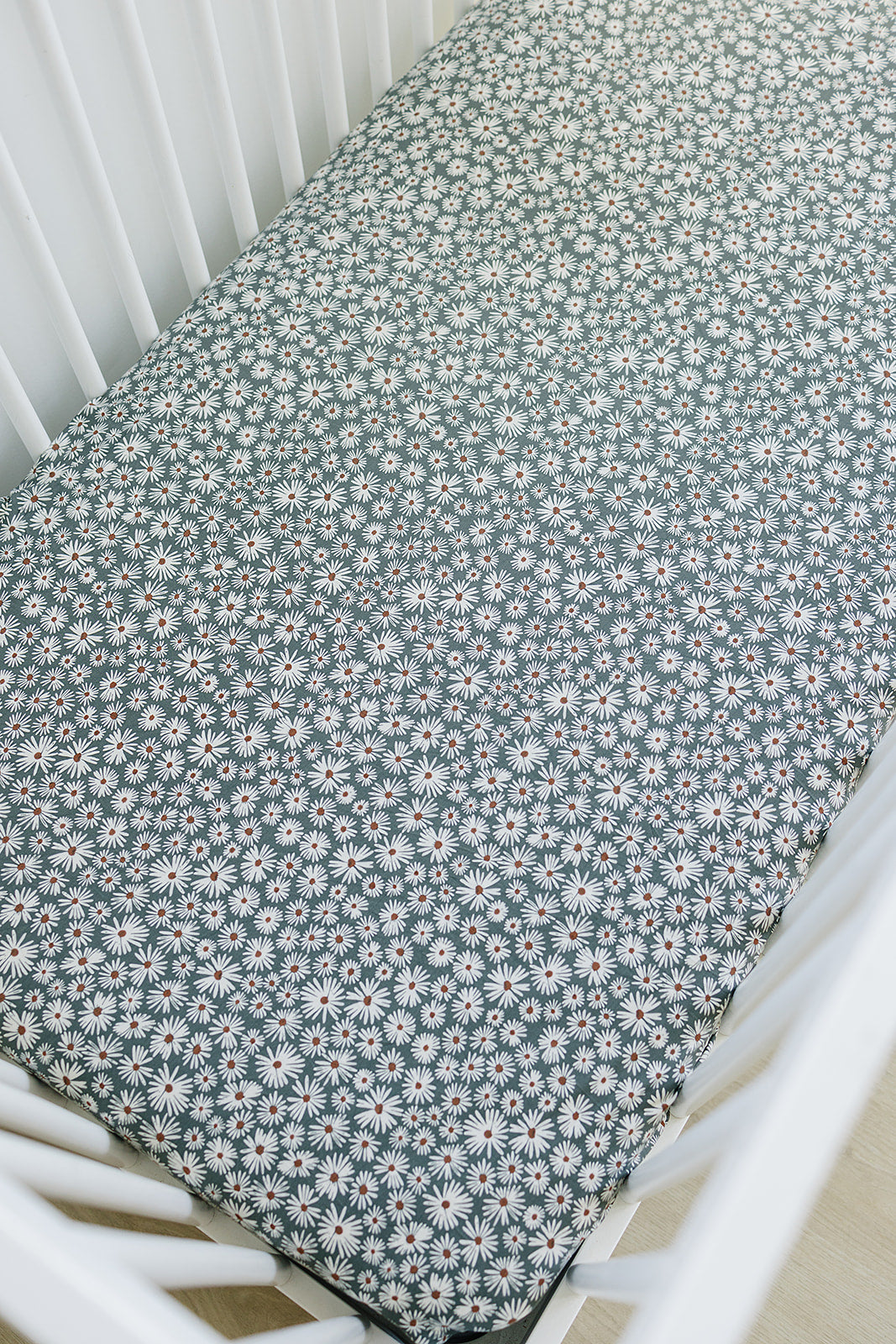 bamboo crib sheet // dark green daisy