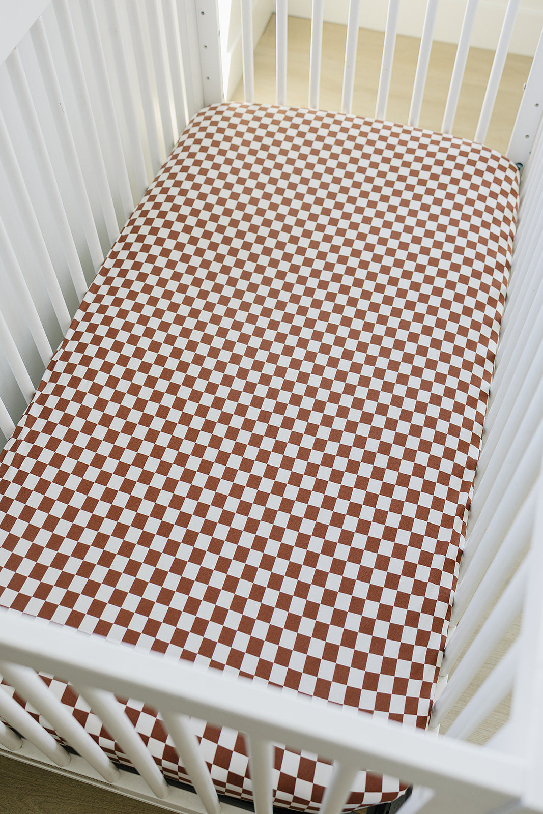 bamboo crib sheet // rust checkered