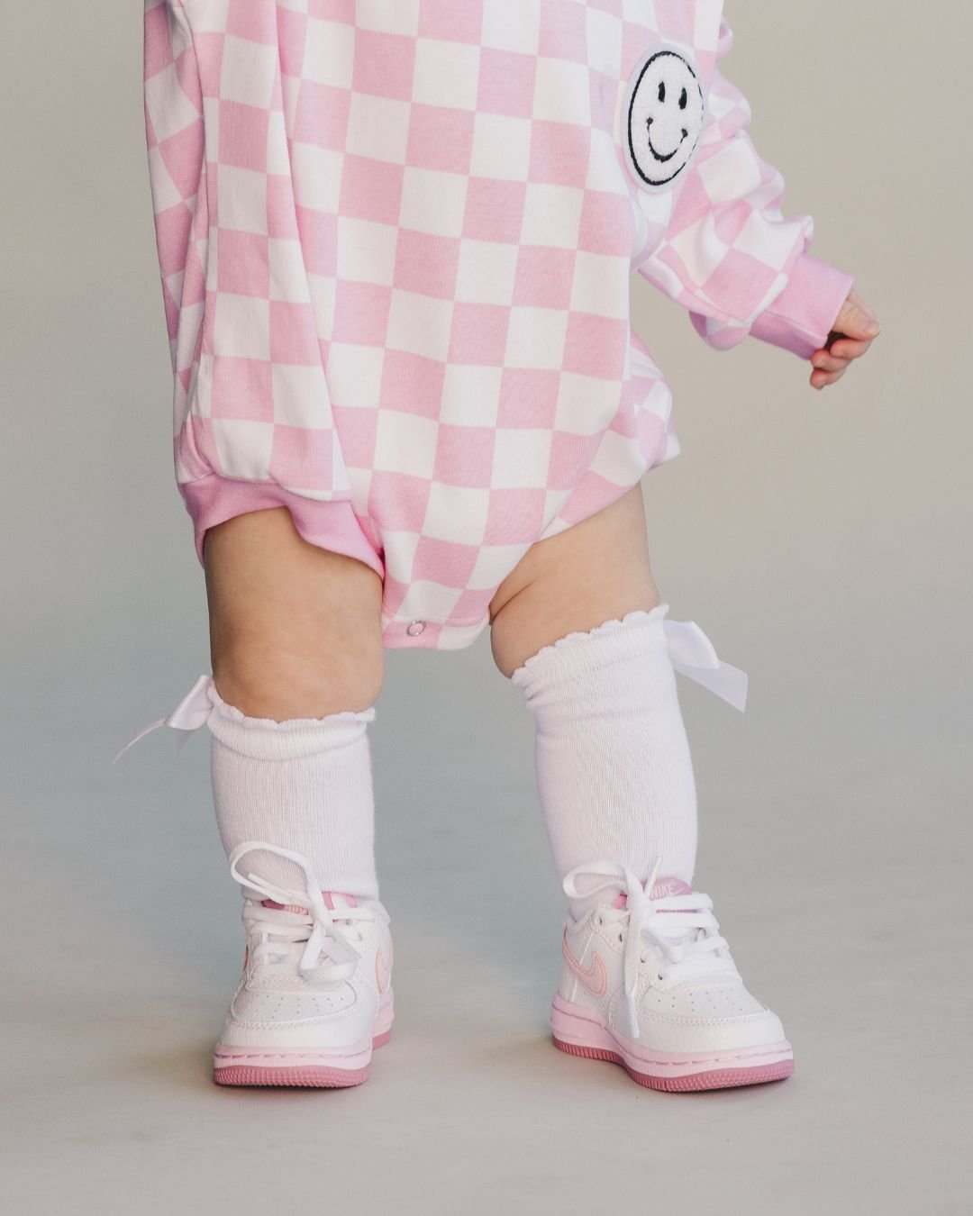 bubble romper // checkered smiley pink