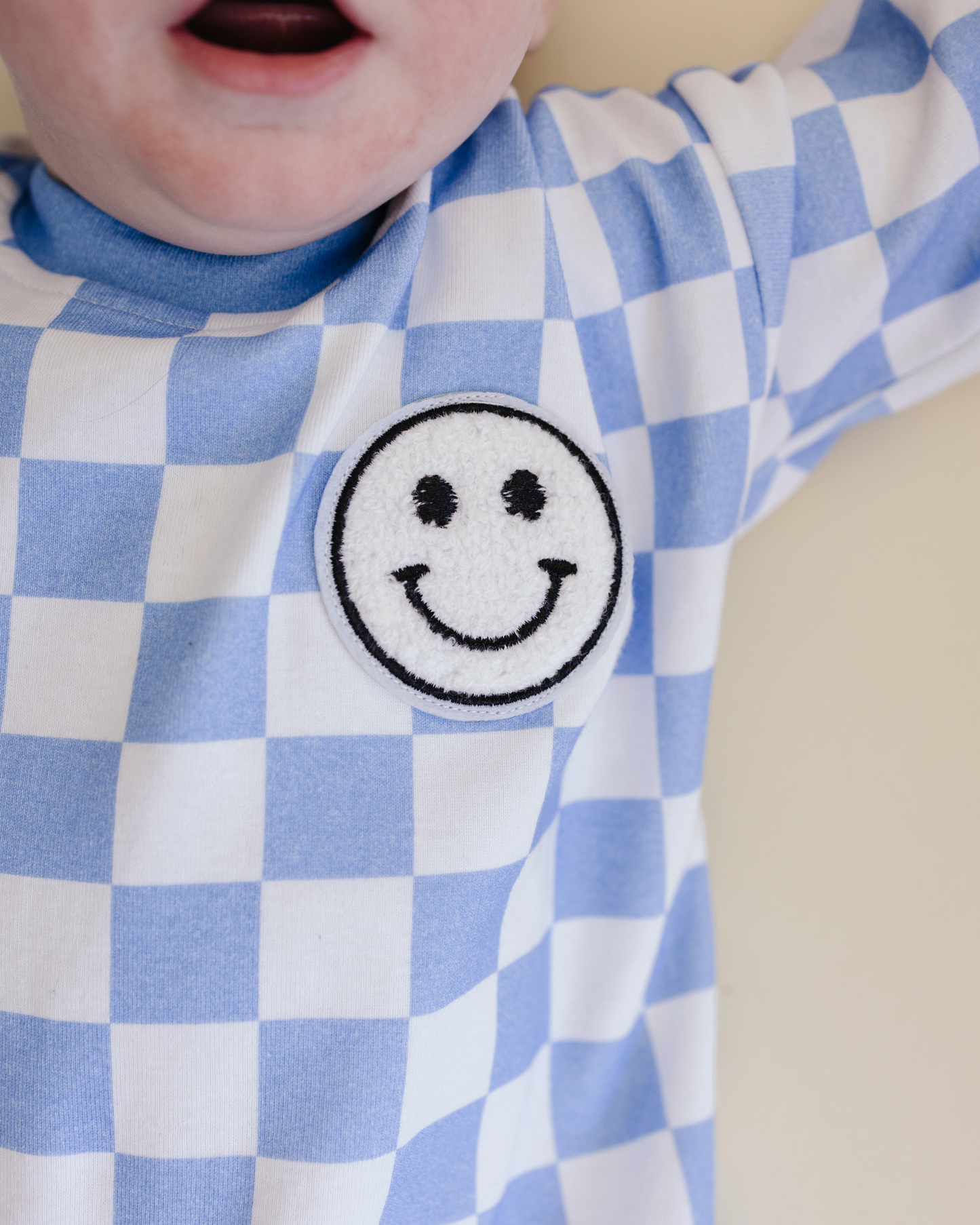 bubble romper // checkered smiley blue