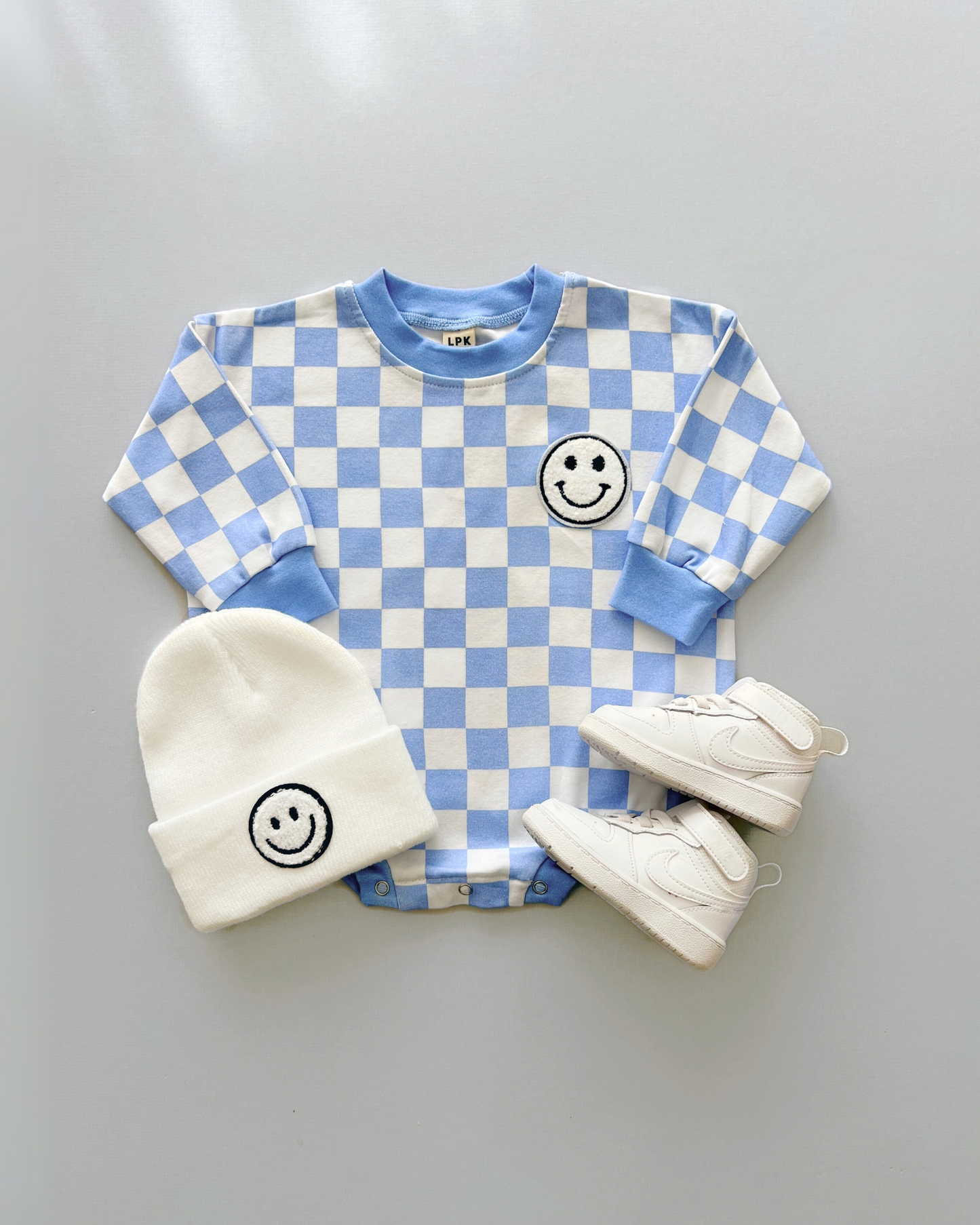 bubble romper // checkered smiley blue