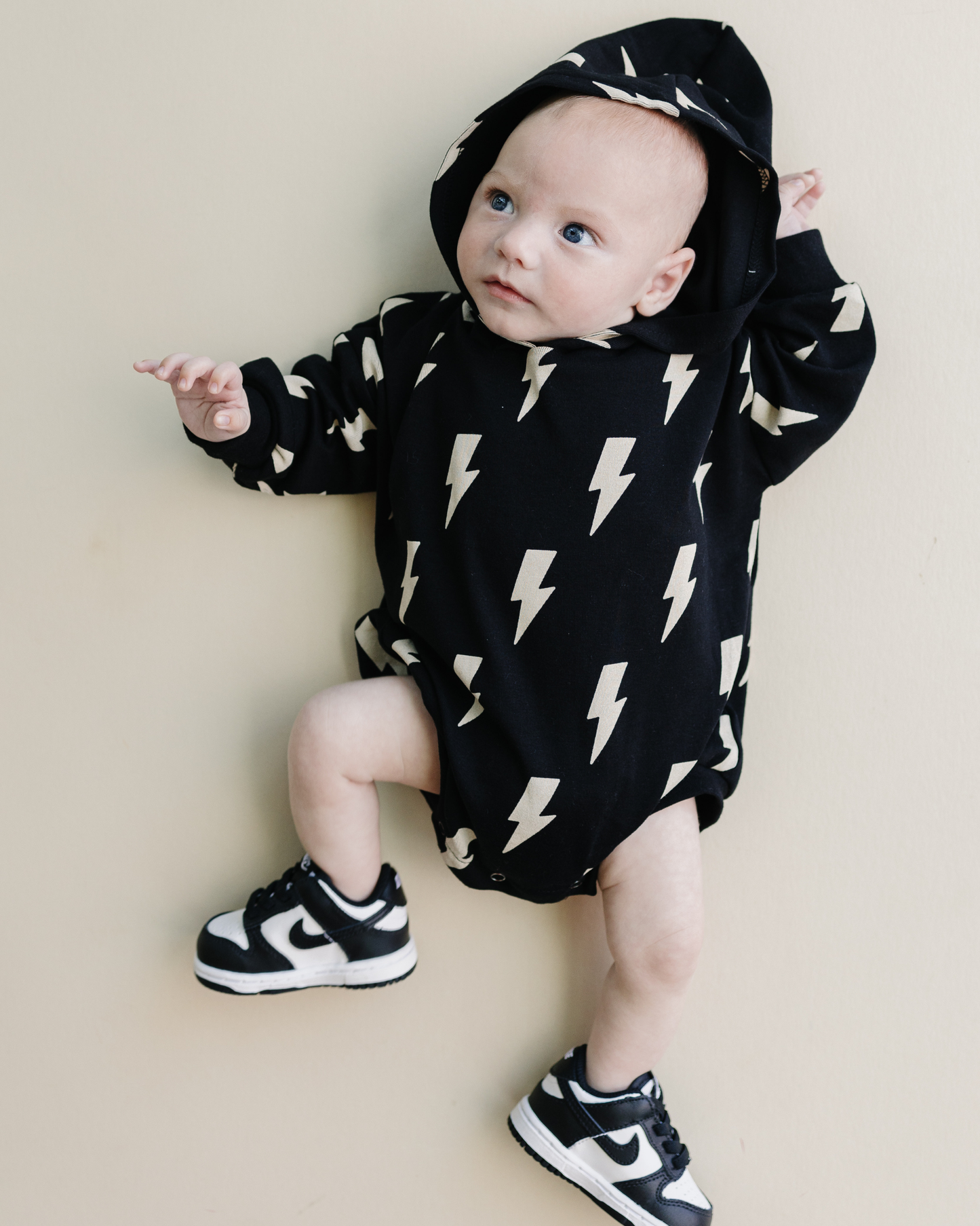 hooded bubble romper // black bolts