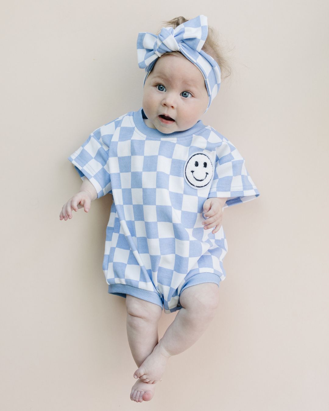 short sleeve bubble romper // checkered smiley blue