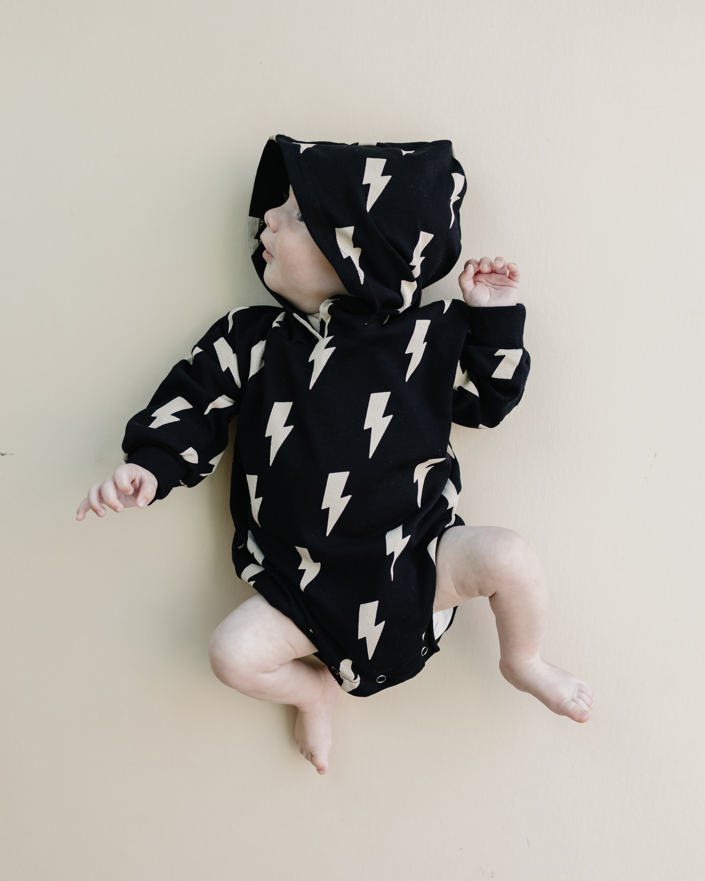 hooded bubble romper // black bolts