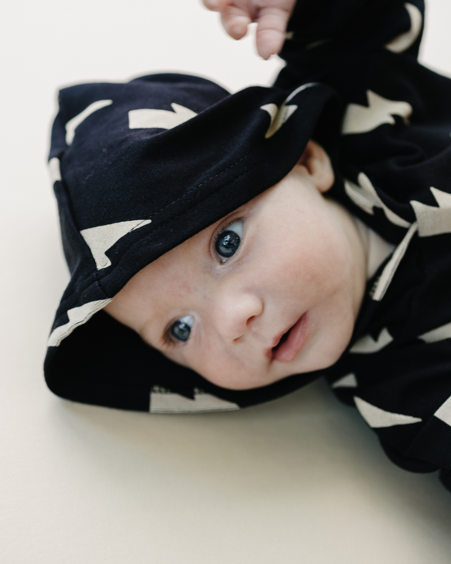 hooded bubble romper // black bolts