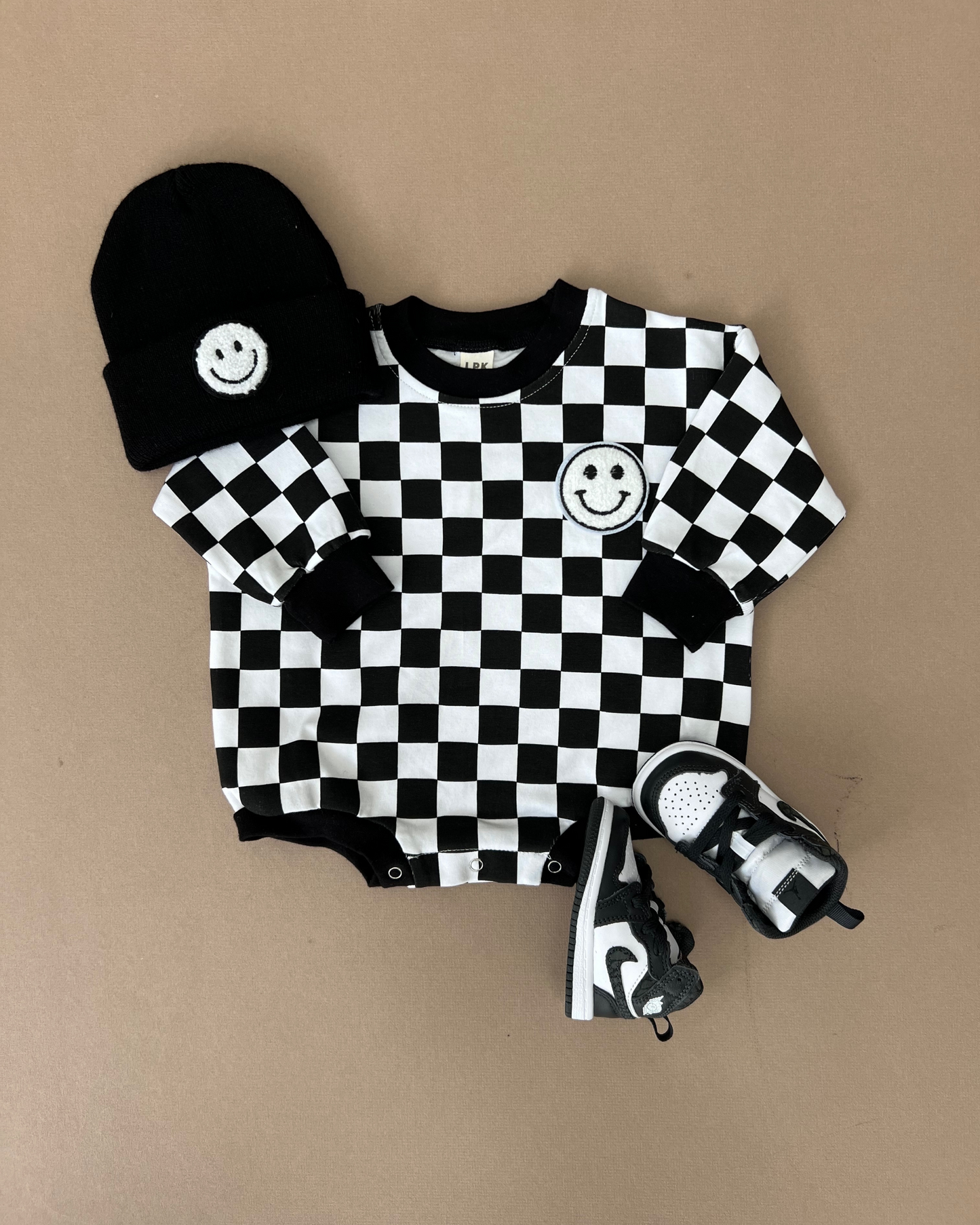 bubble romper // checkered smiley black