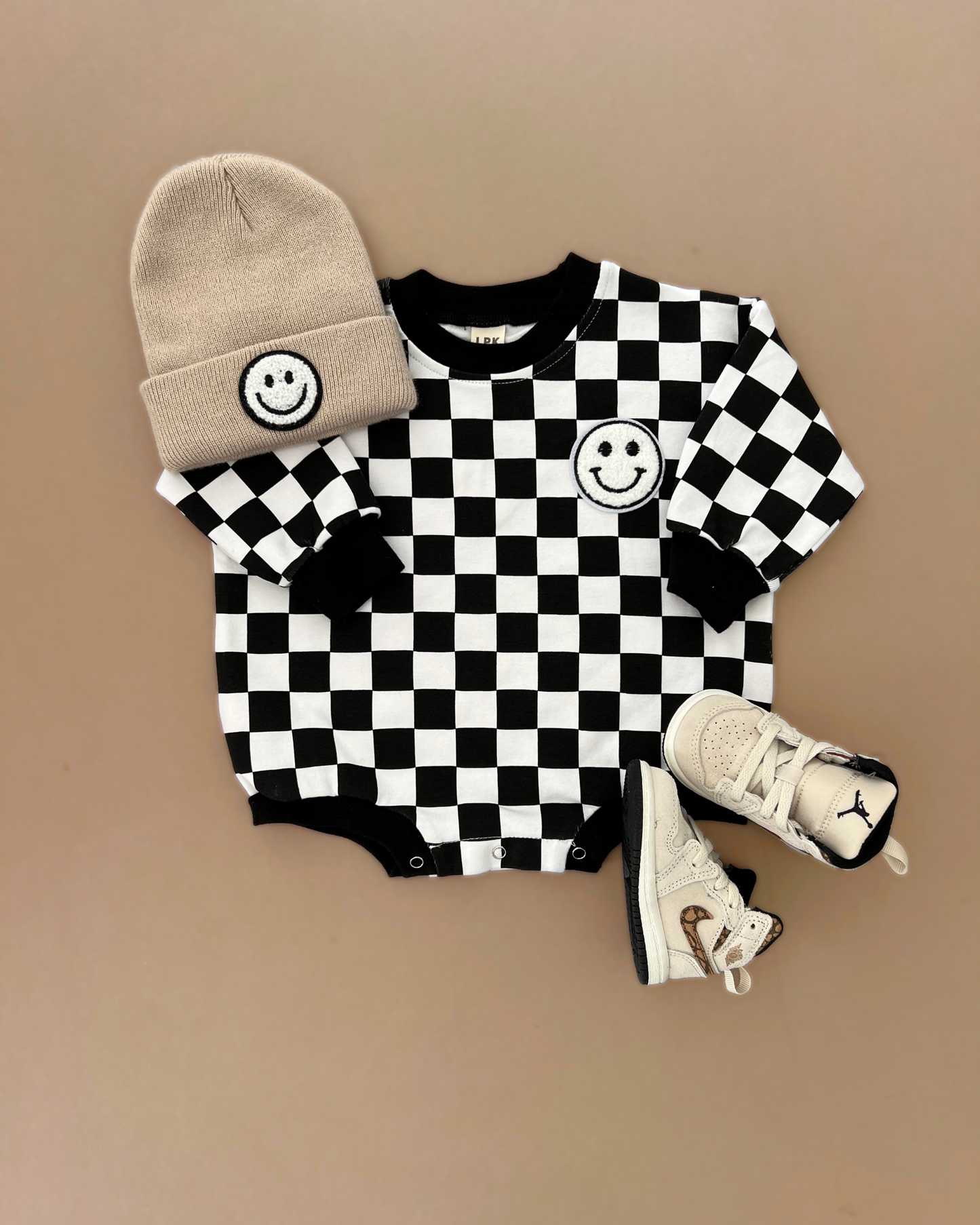 bubble romper // checkered smiley black