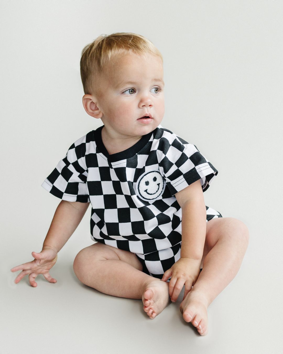 short sleeve bubble romper // checkered smiley black