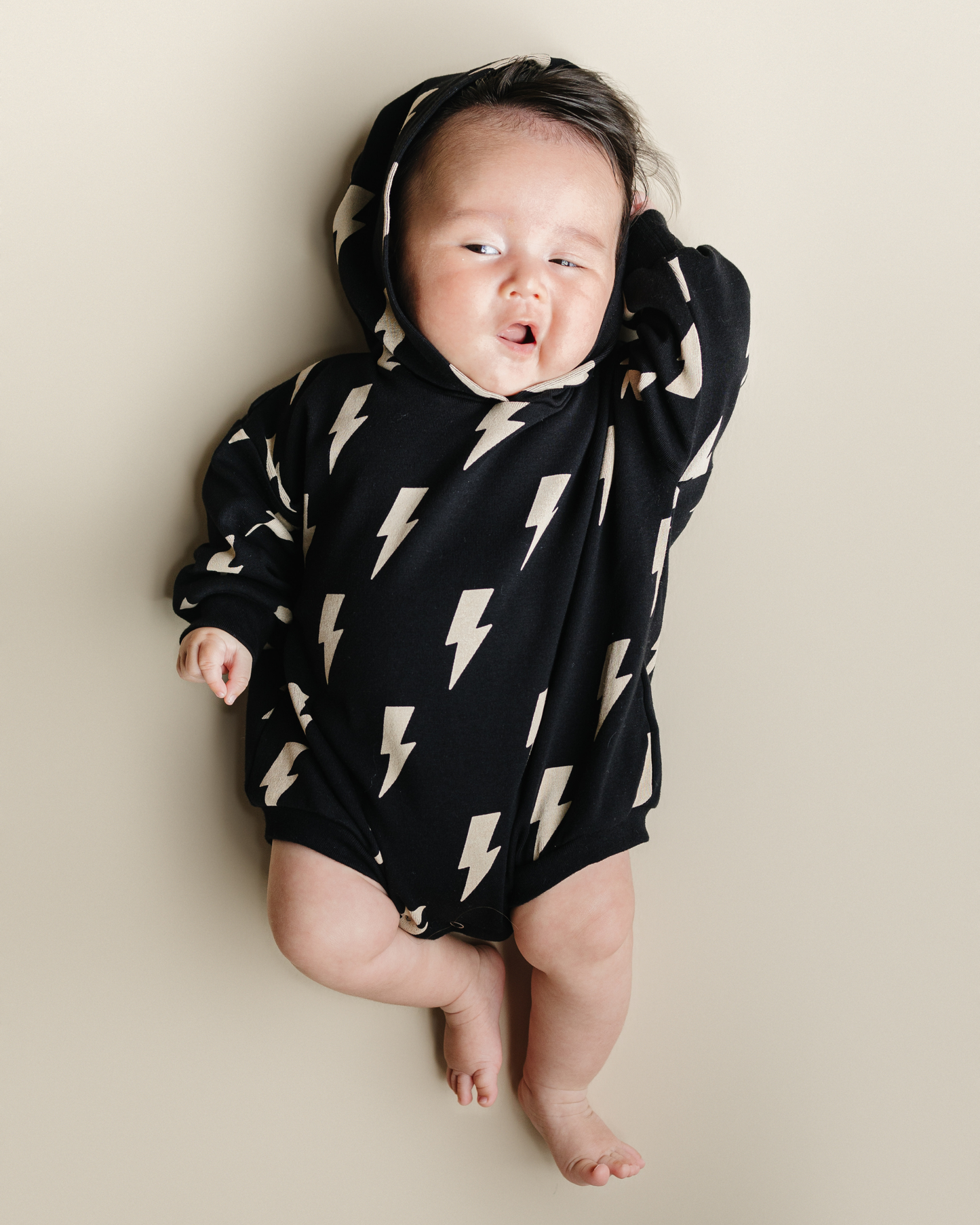 hooded bubble romper // black bolts