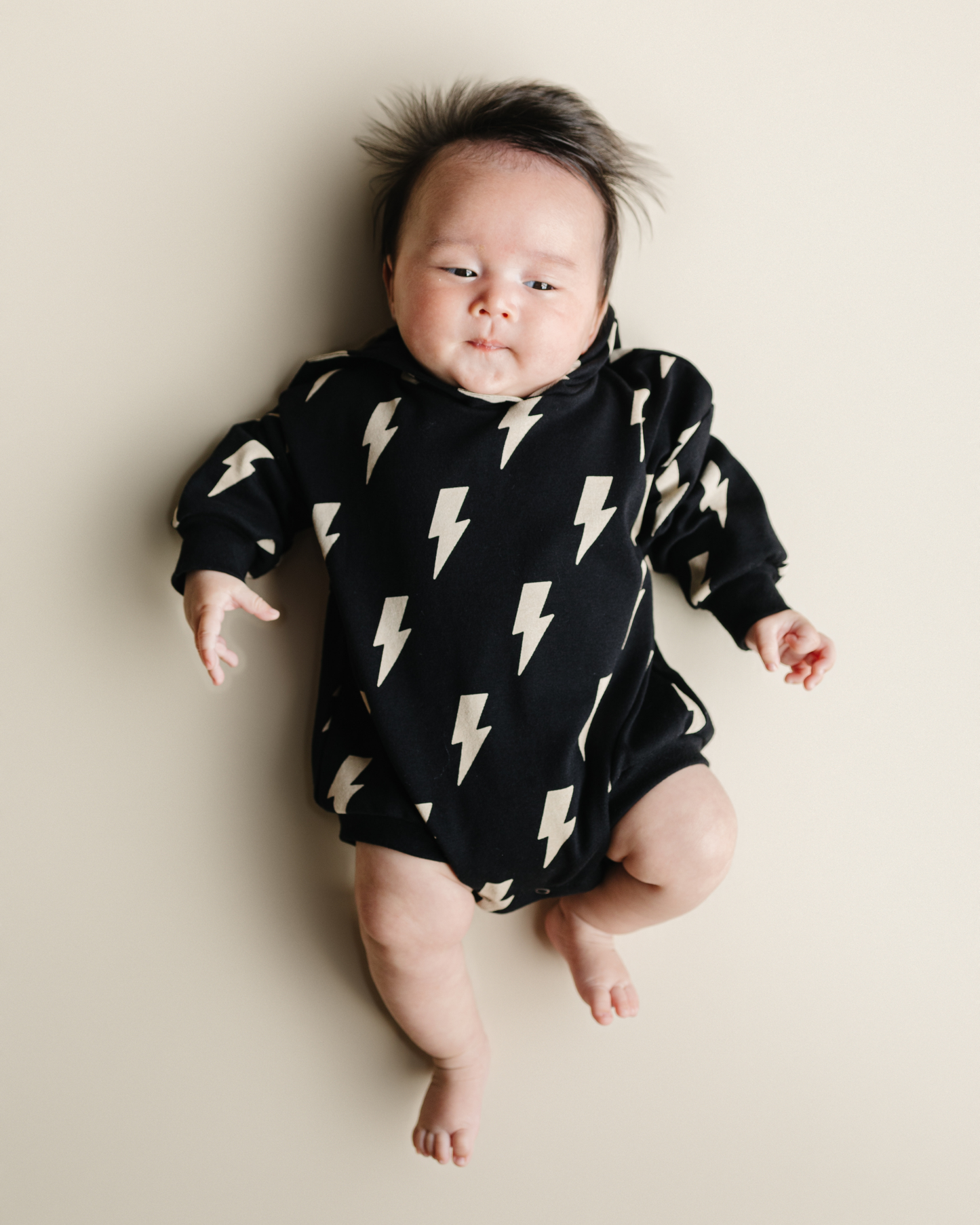 hooded bubble romper // black bolts