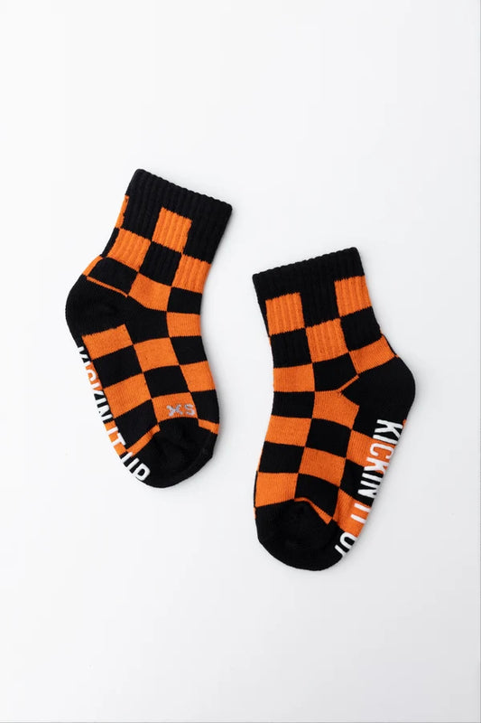 orange + black checkerboard socks