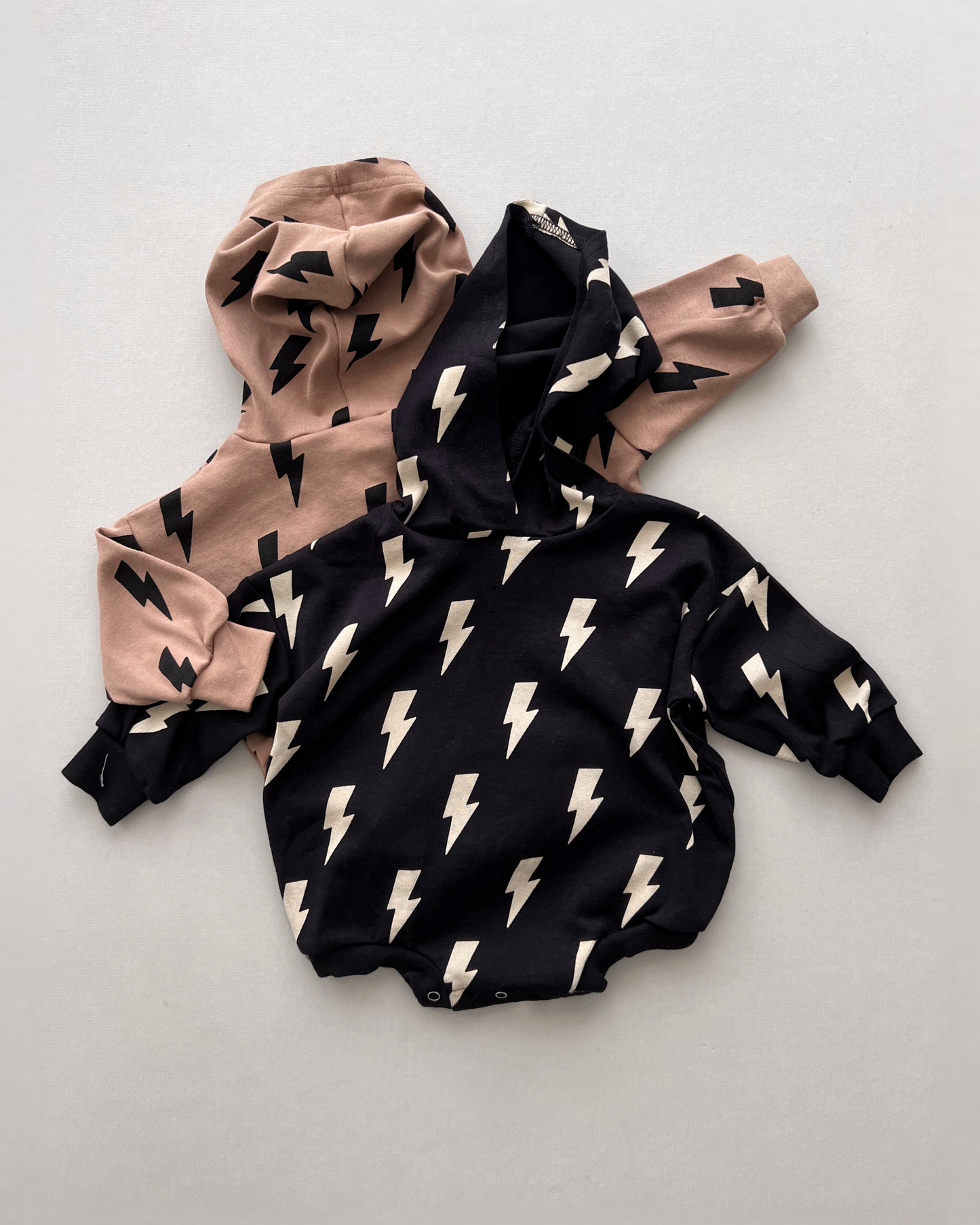 hooded bubble romper // black bolts