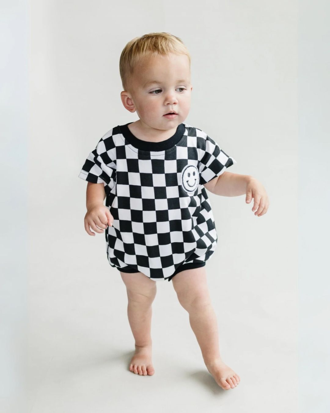 short sleeve bubble romper // checkered smiley black