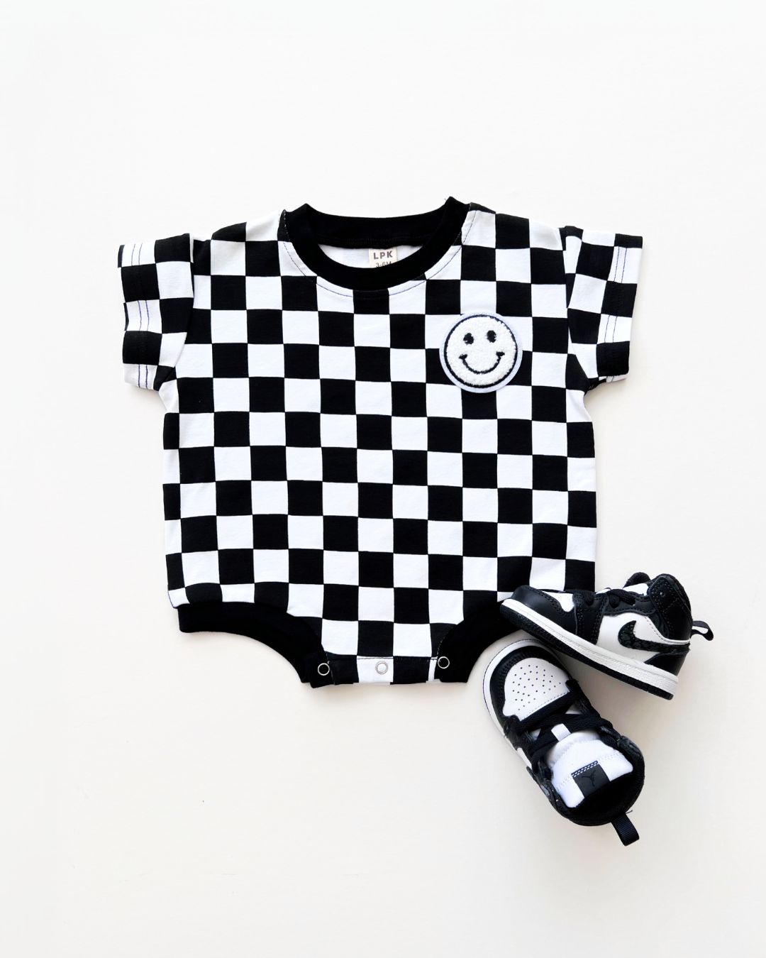 short sleeve bubble romper // checkered smiley black