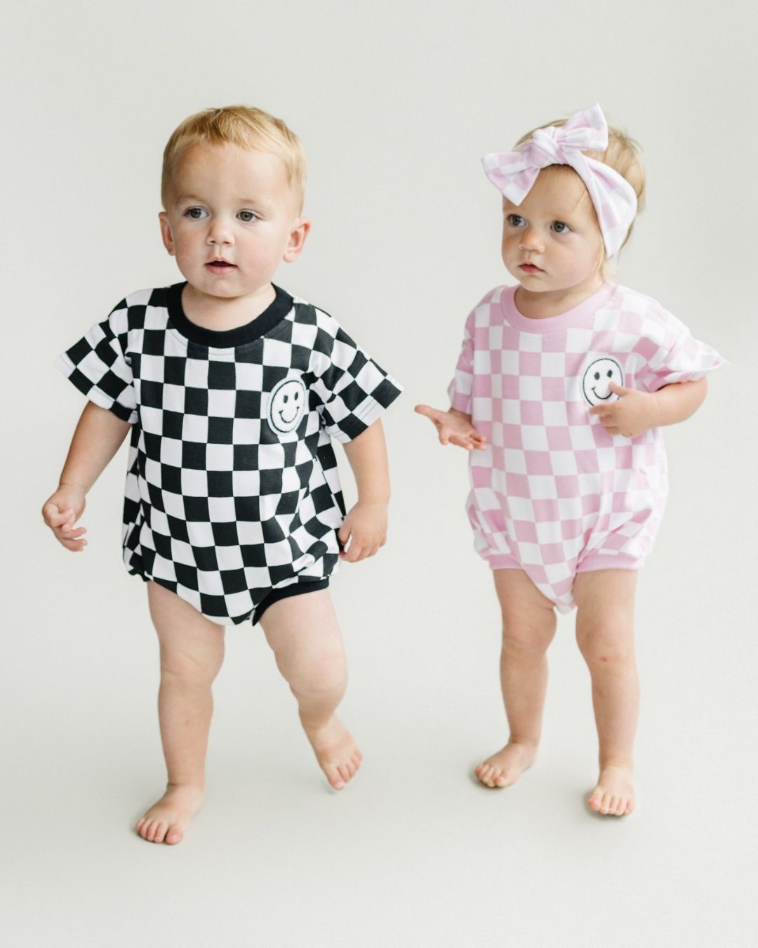 short sleeve bubble romper // checkered smiley black