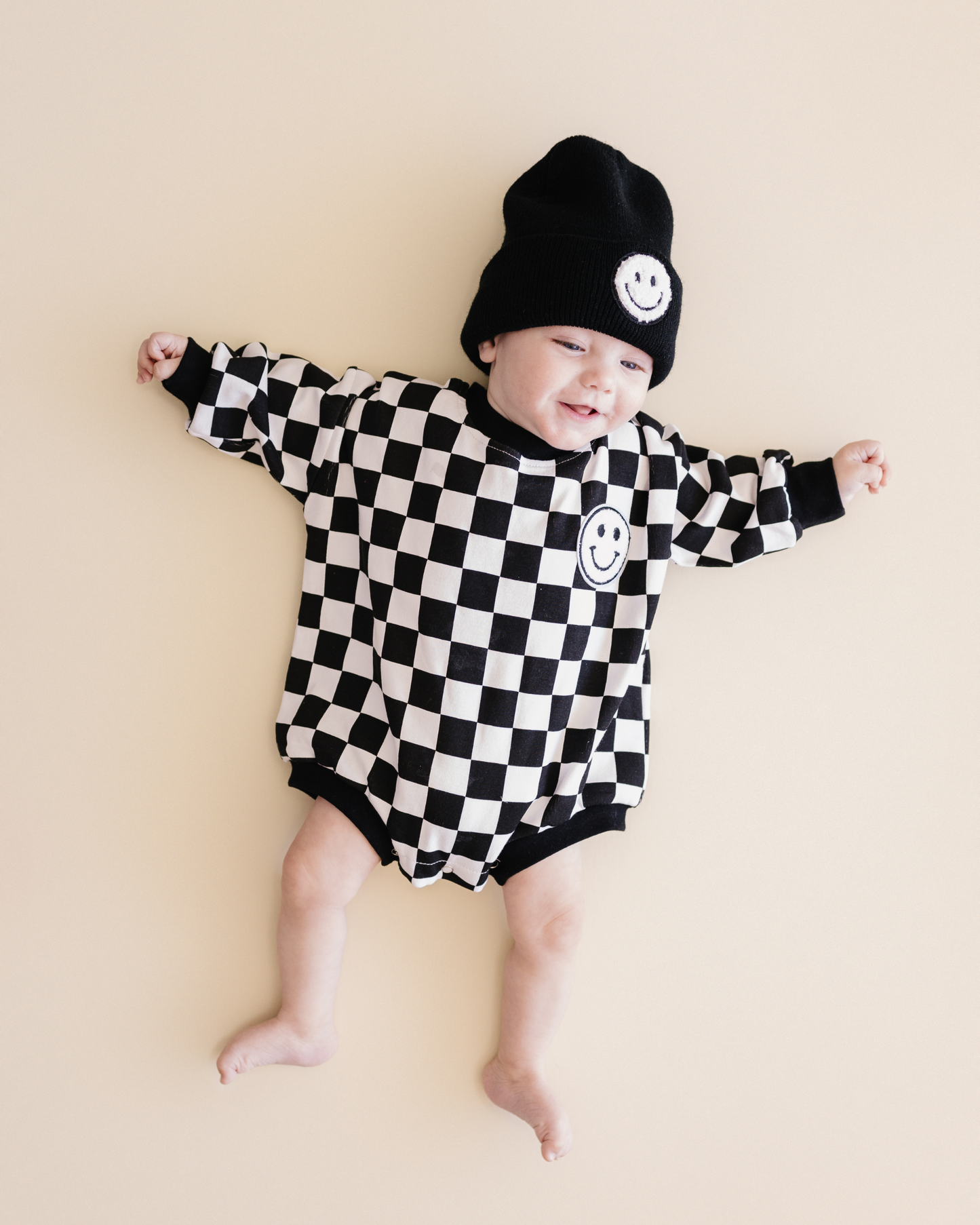 bubble romper // checkered smiley black