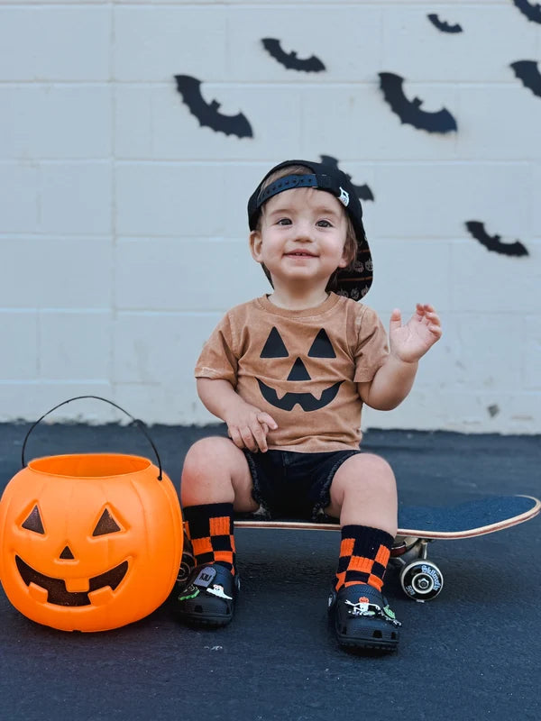 orange + black checkerboard socks