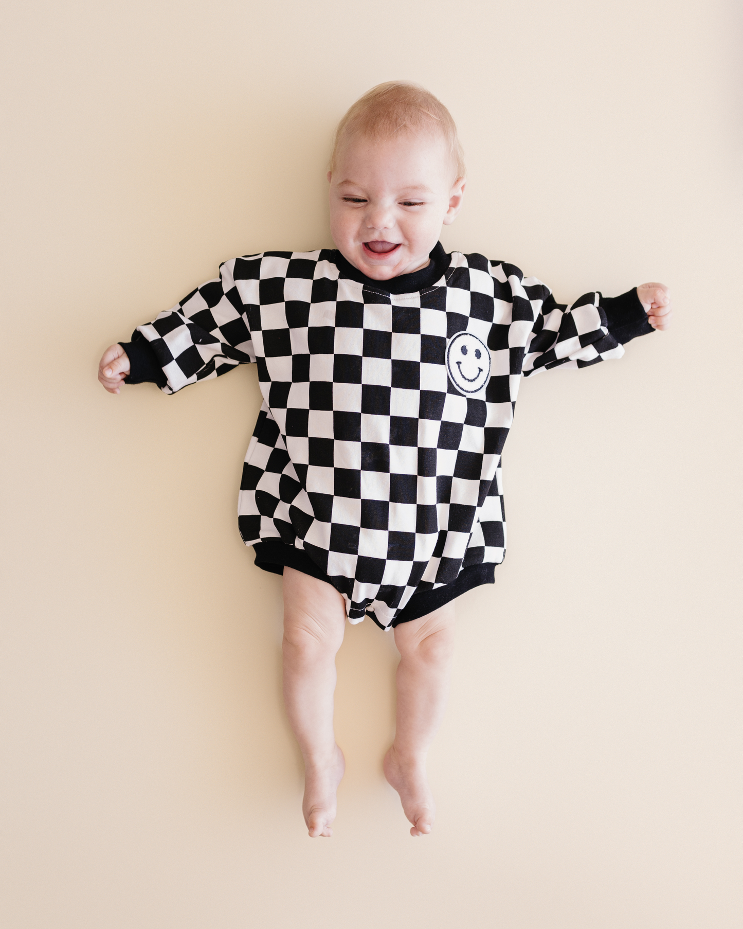 bubble romper // checkered smiley black