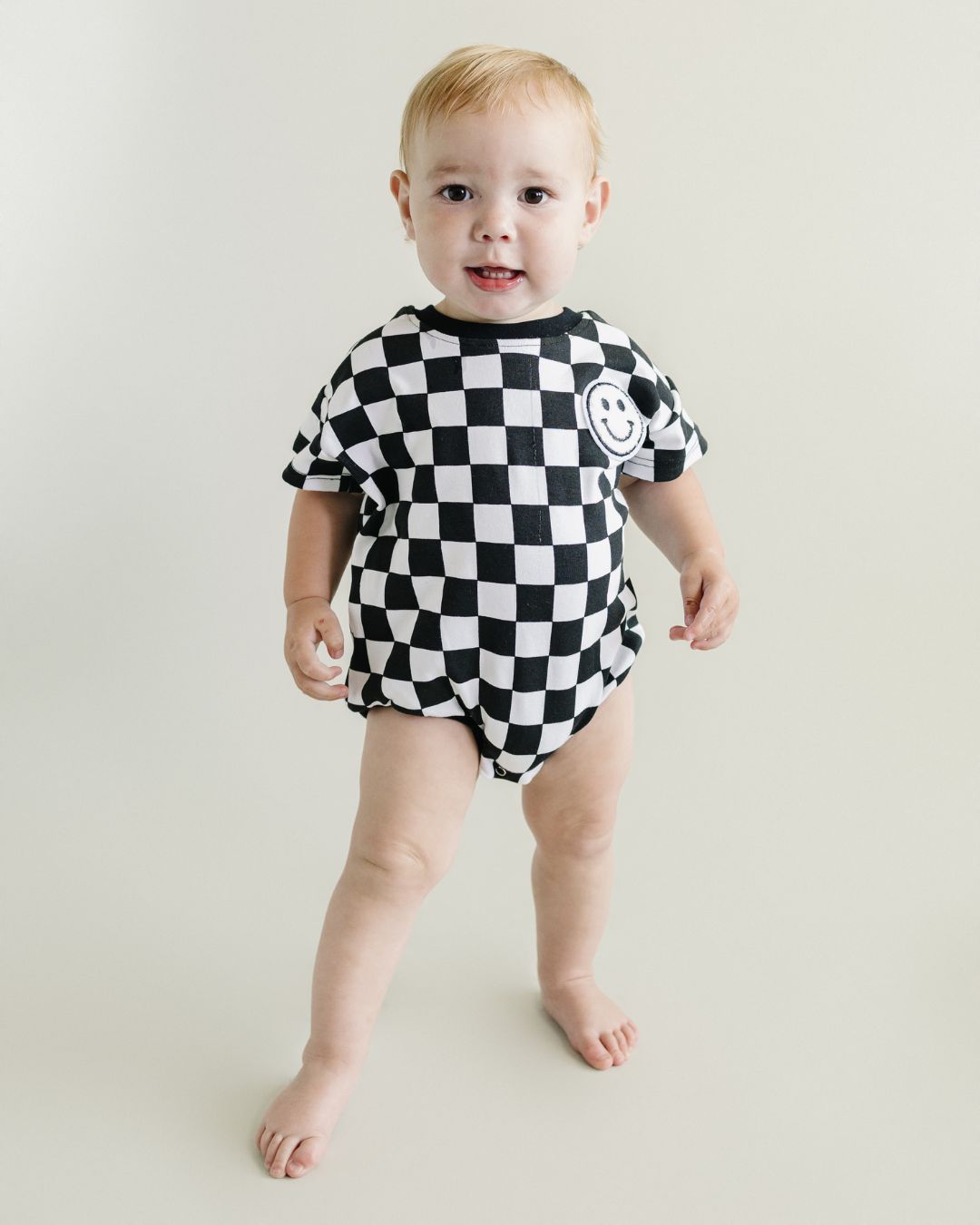 short sleeve bubble romper // checkered smiley black