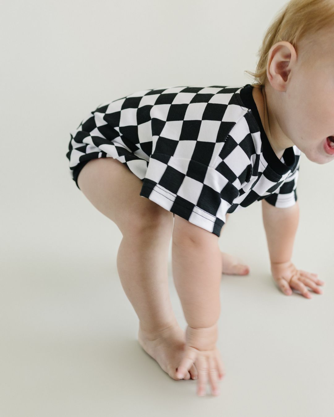 short sleeve bubble romper // checkered smiley black