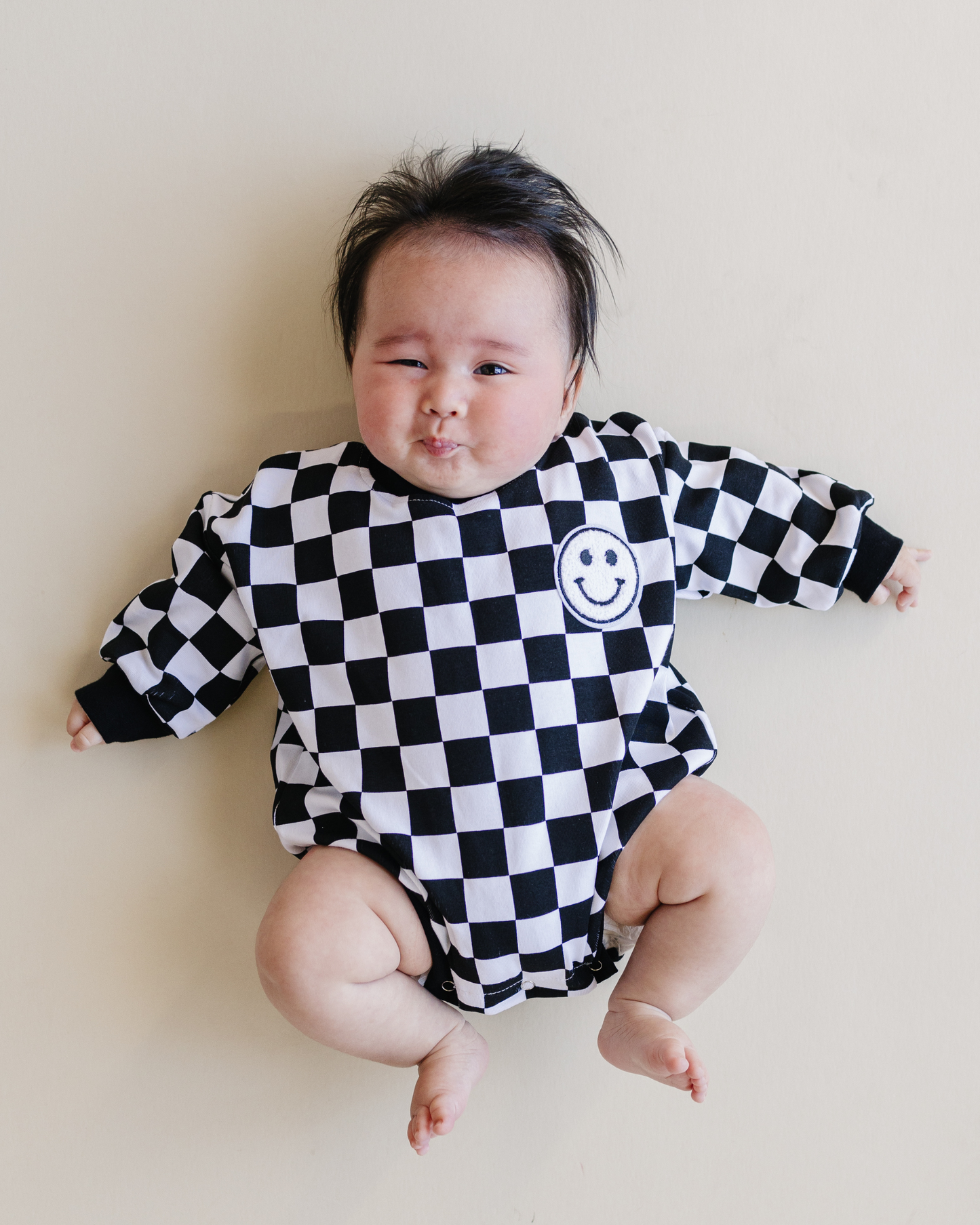 bubble romper // checkered smiley black