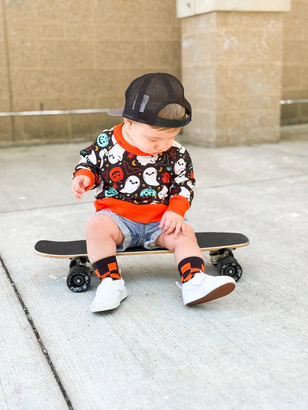 orange + black checkerboard socks