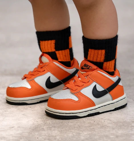 orange + black checkerboard socks