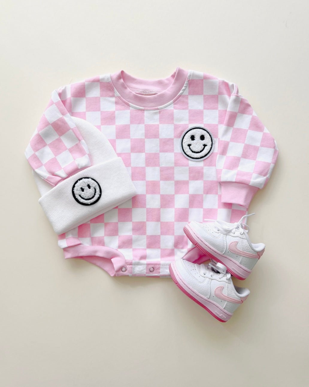 bubble romper // checkered smiley pink